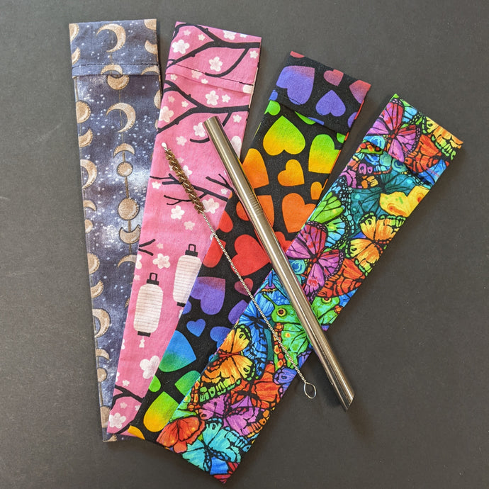 An assortment of reusable cotton boba straw pouches witch bright and colorful patterns. Sold at Coyote Supply Co a BIPOC and LGBTQIA+ owned zero waste witch store in Reno Nevada